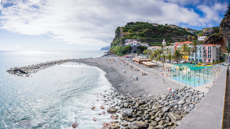 A multi image panorama of the beach, bay and waterfront of Ponta do Sol on the South coast of Madeira, Portugal pictured on 1 August 2024.の写真素材