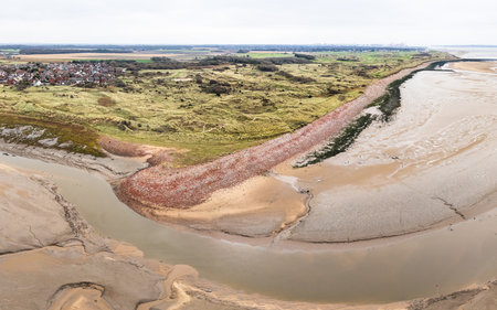 A multi image aerial panorama of the remains of old buildings destroyed during World War Two deposited along the Sefton coast at Hightown next to the River Alt.の写真素材