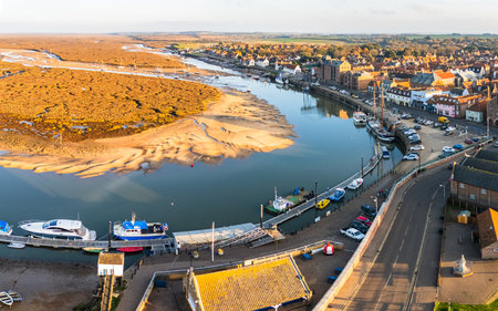 Overhead Wells next the Sea, Norfolk on 7 November 2025 as the golden light spills onto the town,...