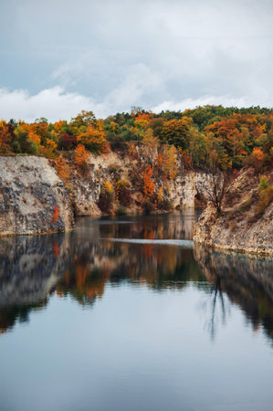 Autumn landscape with colorful forest on the bank of the river.の写真素材