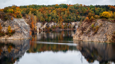 Autumn landscape with a lake in the mountains. Autumn forest on the shore.の写真素材