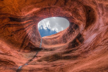 Monument Valley hole  Sandstone formation in Monument Valley during sunset look in the sky thought a hole の写真素材