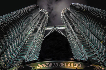 KUALA LUMPUR - APRIL 10: General view of Petronas Twin Towers  at night on Apr 10, 2011 in Kuala Lumpur, Malaysia. The towers are the worlds tallest twin towers with the height of 451.9m.のeditorial素材