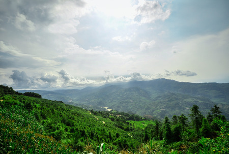 South China, Yunnan - 2011  Rice terraces in highlands of southeastern China, farmhouses, ethnic village  Rice terraces rice paddies Asia, peasant village in mountains China のeditorial素材