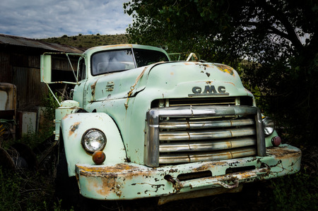 Jerome Arizona Ghost Town mine and old cars on AUGUST 26, 2013 in Jerome, USA.のeditorial素材