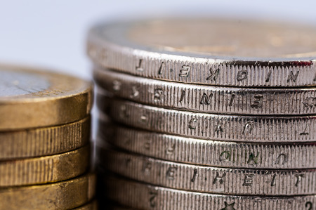stack of coins on white background isolatedの写真素材