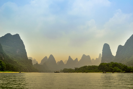 Beautiful Li river bamboo side Karst mountain landscape in Yangsの写真素材