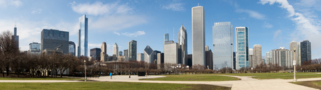 Chicago skyline panorama with skyscrapers over Lake Michigan with cloudy blue sky.の写真素材