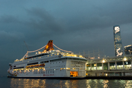 HONG KONG - JANUARY 11: Victoria Harbor on January 21, 2016 in Hong Kong. Big Cruise Ship on Terminal near Victoria Harbor.のeditorial素材