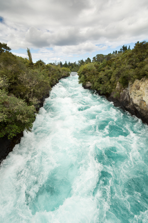 Side view of the rushing wild stream of Huka Falls near Lake Taupo, New Zealandの写真素材