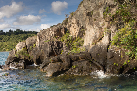 Maori rock carvings at lake taupo water 2016の写真素材