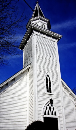 A white church against blue skyの写真素材