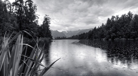 a lake nestled in the New Zealand mountainsの写真素材