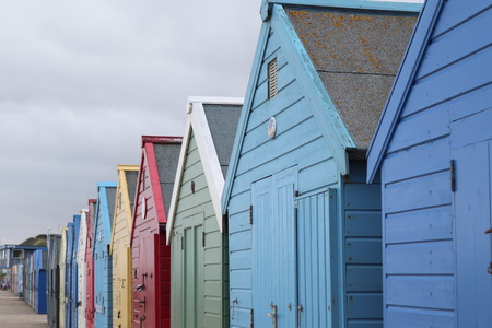 beach huts in a row with names and numbers english coastlineの写真素材