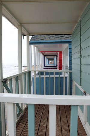 Beach huts holiday hut by the sea with coloured doorsの写真素材
