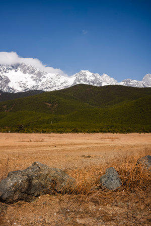 Mountains and meadow in Yading national level reserve, Daocheng, Sichuan Province, China.の写真素材