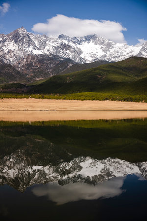 Mountain reflection in the lake, Yading national level reserve, Daocheng County, Sichuan Province, Chinaの写真素材