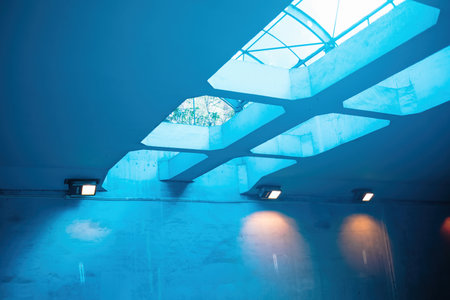 Interior of a modern building with blue walls and blue ceiling.