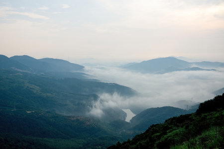 Mountain landscape with fog in the morning at Chiangrai province, Thailand.の写真素材