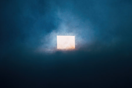 Silhouette of a window in a dark foggy day.