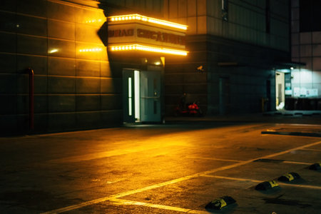 Empty parking lot at night in big city. Shallow depth of field.の写真素材