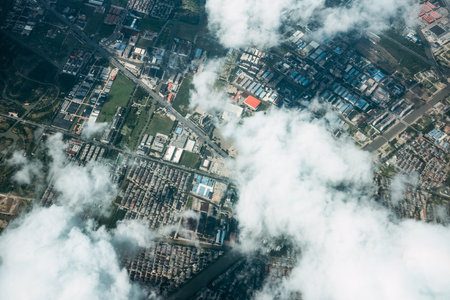 Aerial view of urban area with blue sky and white clouds.の写真素材