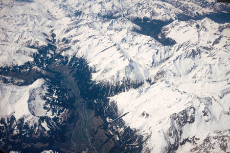 Aerial view of Himalaya mountain range and valley from airplane windowの写真素材