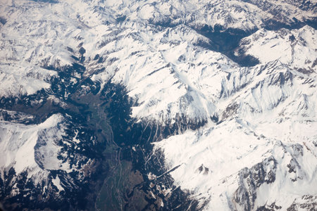 Aerial view of snow covered Himalayan mountain range from the airplaneの写真素材