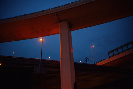 Bridge in the city at night, Bangkok, Thailand. View from below.