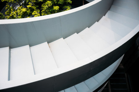Close up view of spiral stairs in a modern office building, stock photo