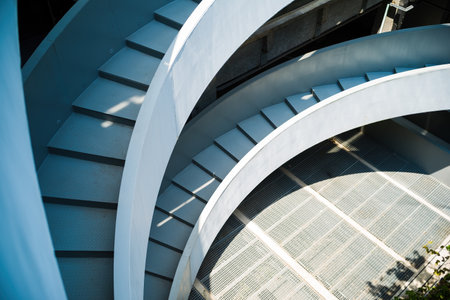 Spiral staircase with sun light in modern building, stock photoの写真素材