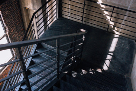 Staircase with metal railing in the old building, vintage toneの写真素材