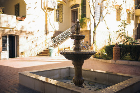 Fountain in the courtyard of a beautiful house in the city.