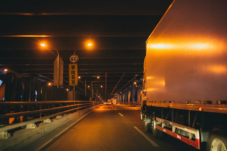 Truck on the road at night in the city, Thailand.