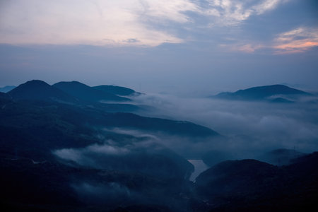 Mountain landscape with fog and clouds in the morning, China.の写真素材