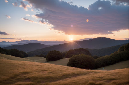 Sunset in the mountains. Beautiful landscape with hills and forest.の素材