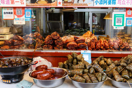 Zongzi, traditional glutinous rice and its fresh ingredients are for sale in Qibao, China.