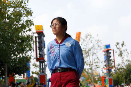 Shanghai, China â November 4, 2019: Disneyland staffs monitor the famous Disneyland parade as it happens.のeditorial素材