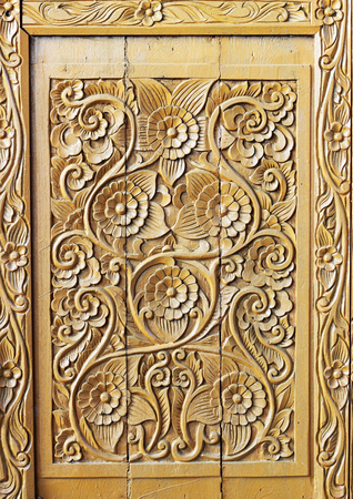 Pattern of flower carved on wood backgroundの写真素材