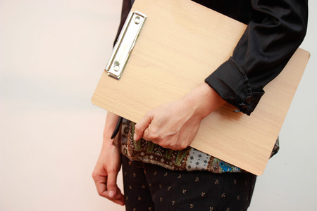 Woman holding with clipboardの写真素材