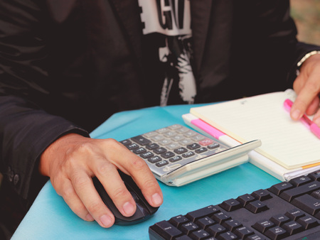 Asian woman counting moneyの写真素材