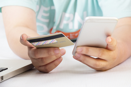 Business, beautiful woman shopping online with laptop and credit card, sale and business concept, soft focusの写真素材