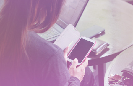 Asian woman using mobile smart at hotelの写真素材