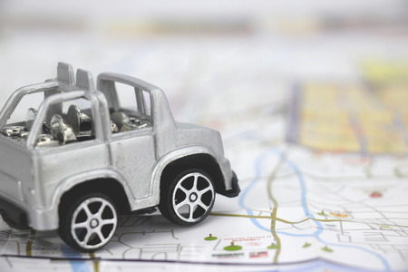 pastic car toy background to travel concept.の写真素材