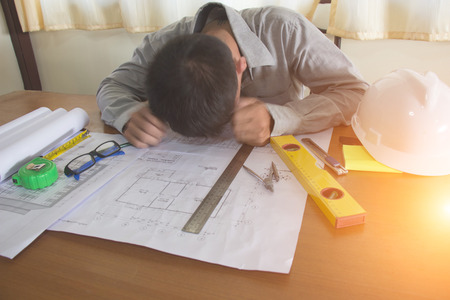 Business, Depressed engineerman in office, Bussiness concept, soft focus, vintage toneの写真素材