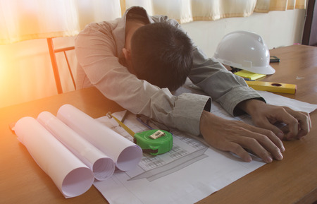 Business, Depressed engineerman in office, Bussiness concept, soft focus, vintage toneの写真素材