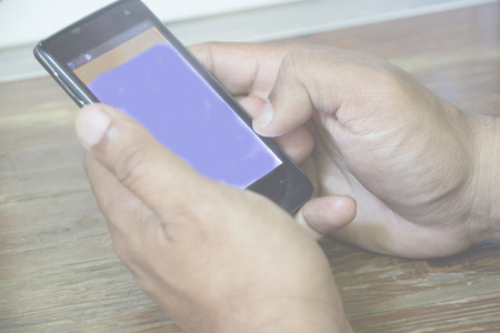 Male holding  smartphone with social Internet service