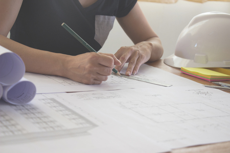 Desk of Architectural working project in construction siteの写真素材