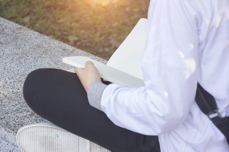 Teen girl open white bookの写真素材