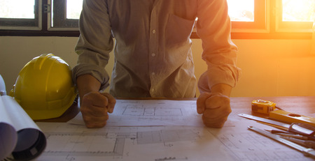 Engineer and Architect planing and discuss at Construction Site with blueprintの写真素材